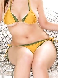Hitomi Kitamura posing sexy big tits in yellow bikini