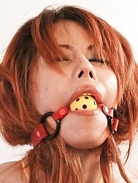 Moe Aizawa Asian with boobs in yellow ropes is fingered in slit