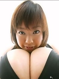 Chubby japanese babes Fuko posing her moster tits in a black bikini