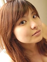 Hanai Miri wearing gold bikini covering her big hooters
