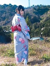 Asian big breasted Hana Haruna posing in a traditional japanese dress her huge tits!