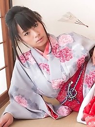 Asian big breasted Hana Haruna posing in a traditional japanese dress her huge tits!