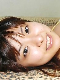 Hanai Miri in posing her big tits in bikini.