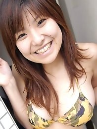 Hanai Miri in posing her big tits in bikini.