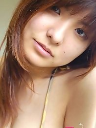 Hanai Miri in posing her big tits in bikini.