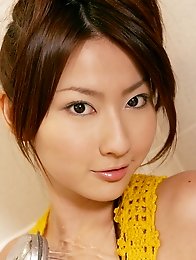 Busty and cute Japanese av idol Megumi Haruka wears a yellow one piece and takes shower