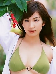 Enchanting asian chick Junko Yaginuma tempts at the beach with her soft boobs