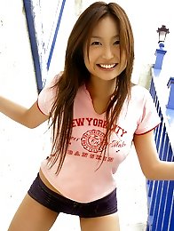Bouncey asian beauty playfully shows off her plump tits in bikini