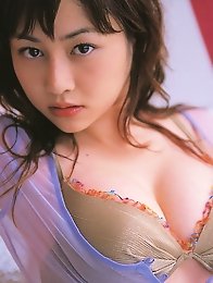 Sizzling hot gravure idol babe with soft plump boobs in a bikini