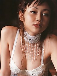 Sizzling hot gravure idol babe with soft plump boobs in a bikini